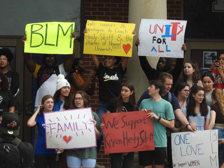 PC students hold up signs supporting Howard University at Templeton. 