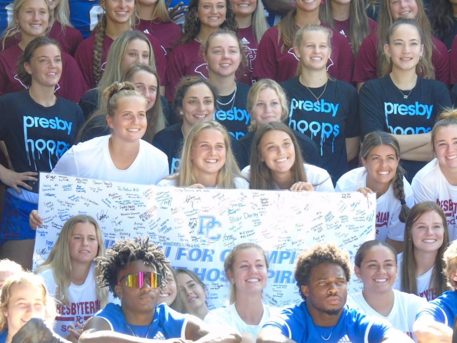 The Blue Hose softball, womens basketball, and womens soccer team pose for the camera.