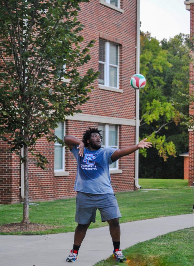 Marquise Peele serving the ball.