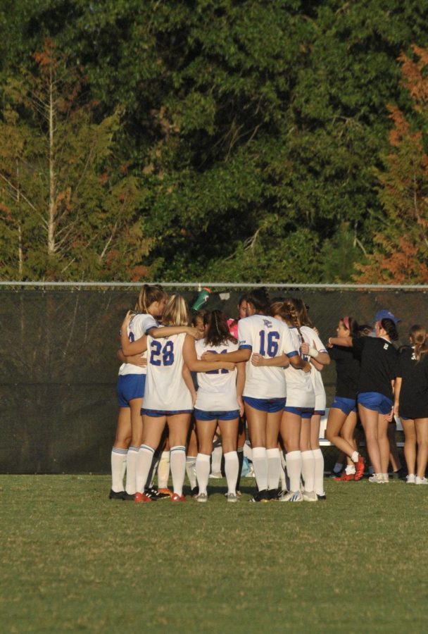 Blue Hose players do their ritual prior to the start of the game.