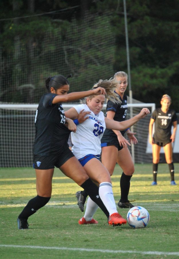 Freshman Sloan Spees fighting her way to possess the ball.