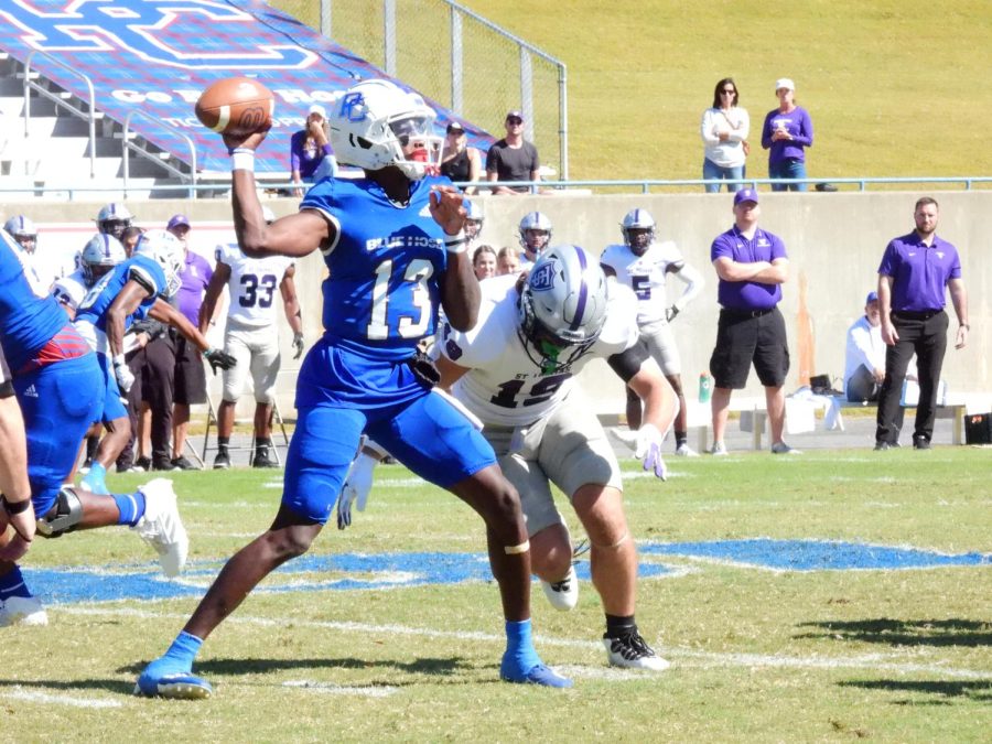 Blue Hose quarterback Tyler Wesley releases a pass before getting hit.
