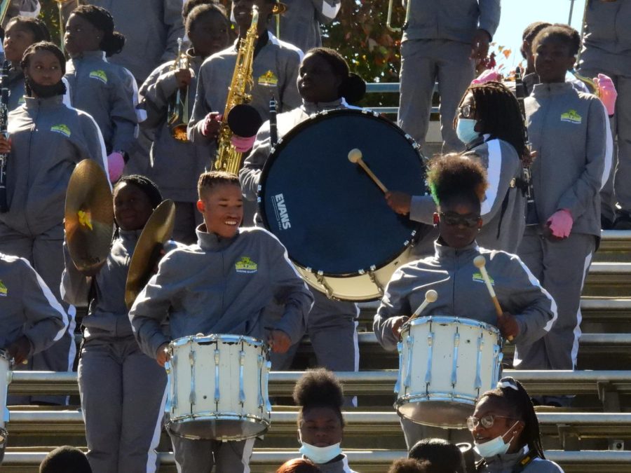 The Dillon High School marching band plays music in the stands.