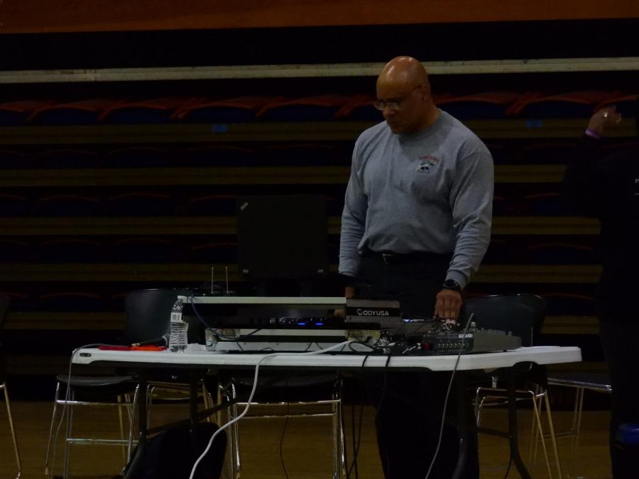 A DJ plays music at the MSU pep rally.