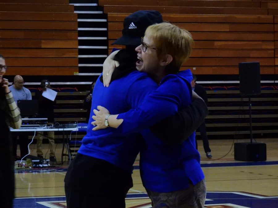 English professor Dr. Lynne Simpson celebrates after winning the dance-off competition.